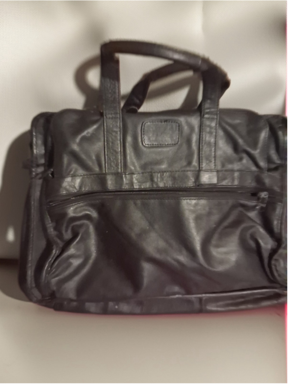 vintage Tumi Black Leather Briefcase featuring a soft textured leather body